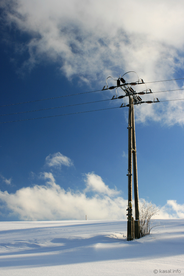 Power pole with blue sky